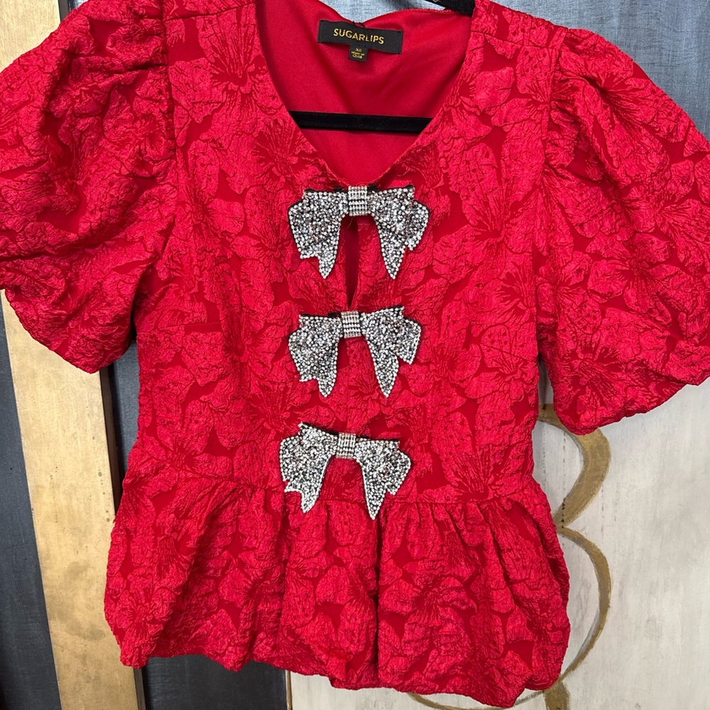 Sugarlips Red Textured Peplum Top with Rhinestone Bow Accents